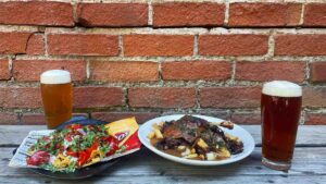 Frito Pie and Duck Confit Fries at Drake's Dealership